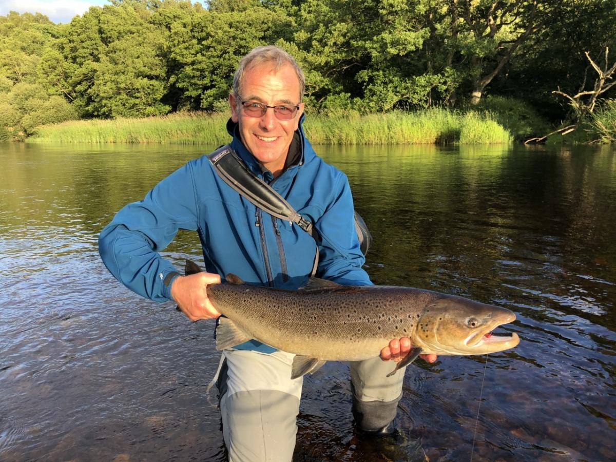 Robson Green lands an 11lb trout in the River Tyne
