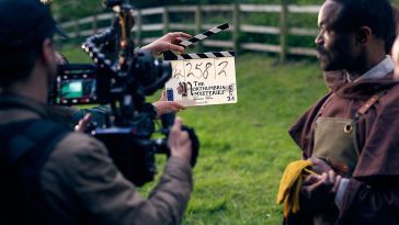 Behind the camera view and clapper board